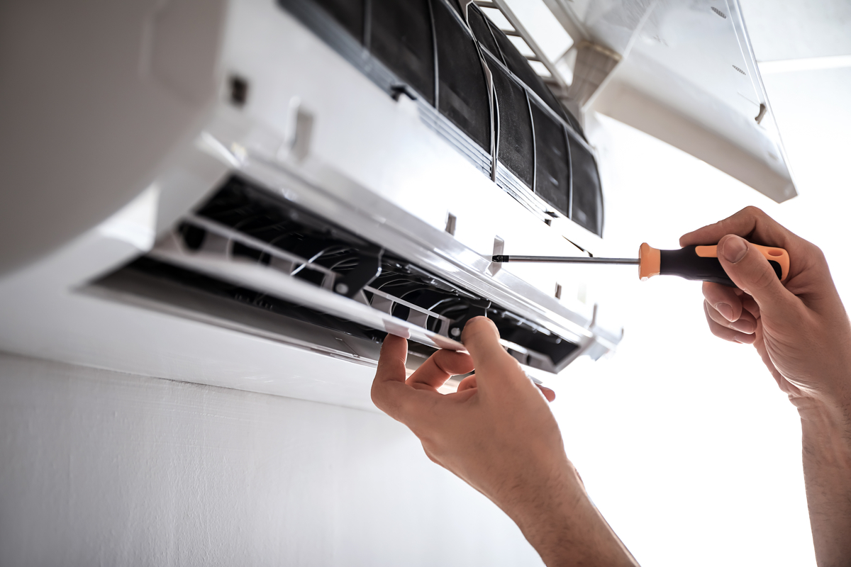 HVAC technician repairing ductless mini split